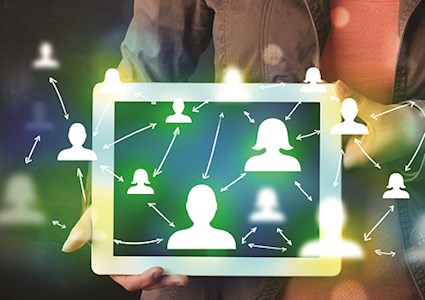 Representing crowdsourcing, a digital tablet being held with icons of interconnected people