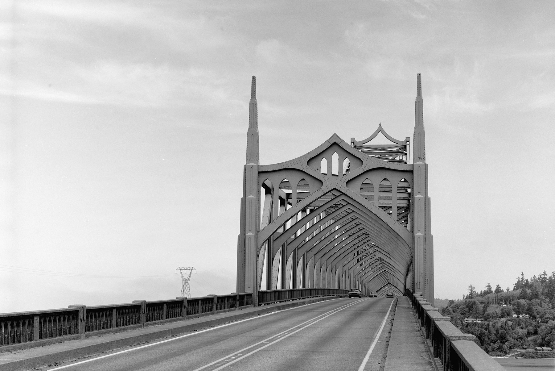 Cross bracing over a roadway looks like the spires of a Gothic cathedral. 