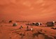 A series of cylindrical habitats are shown on the surface of Mars along with a vehicle and several astronauts, all against a red sky and red regolith.