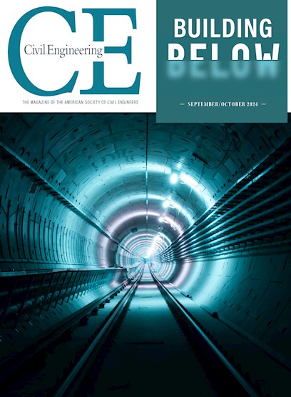 Photograph shows an underground subway tunnel. There is a light at the end of the tunnel. 